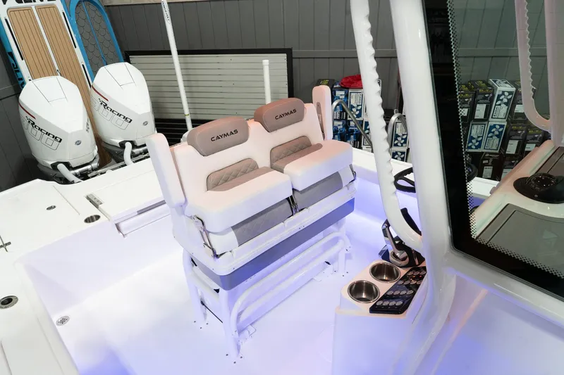 Slide: The Image of 2024 Caymas 281 HB boat interior with dual seats and modern controls. - 22