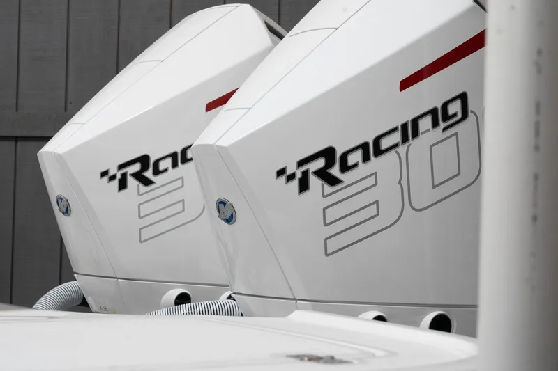 Slide: The Image of Twin outboard engines on a 2024 Caymas 281 HB boat. - 4