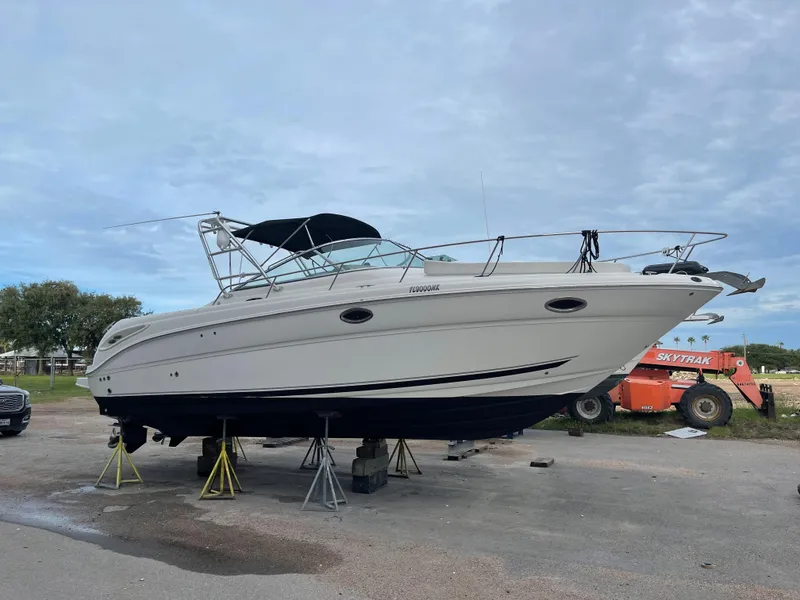 Slide: The Image of 2006 Sea Ray 290 Amberjack boat on stands, side view. - 10