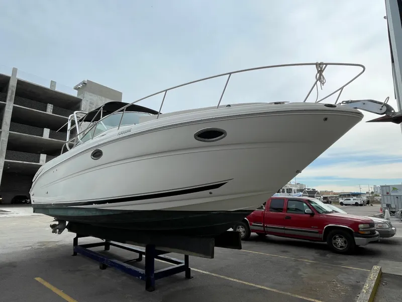Slide: The Image of 2006 Sea Ray 290 Amberjack boat on display in a parking lot. - 19