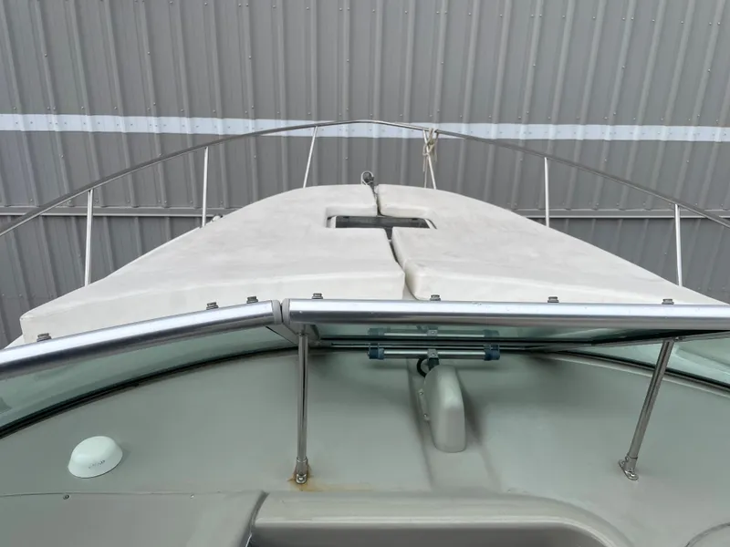 Slide: The Image of 2006 Sea Ray 290 Amberjack boat deck with railing and hatch. - 32