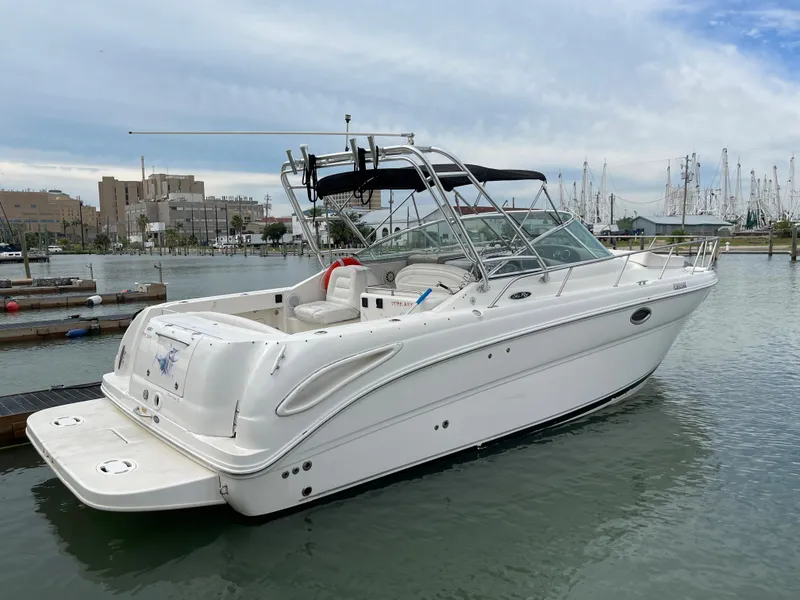 Slide: The Image of 2006 Sea Ray 290 Amberjack boat docked in a marina. - 4
