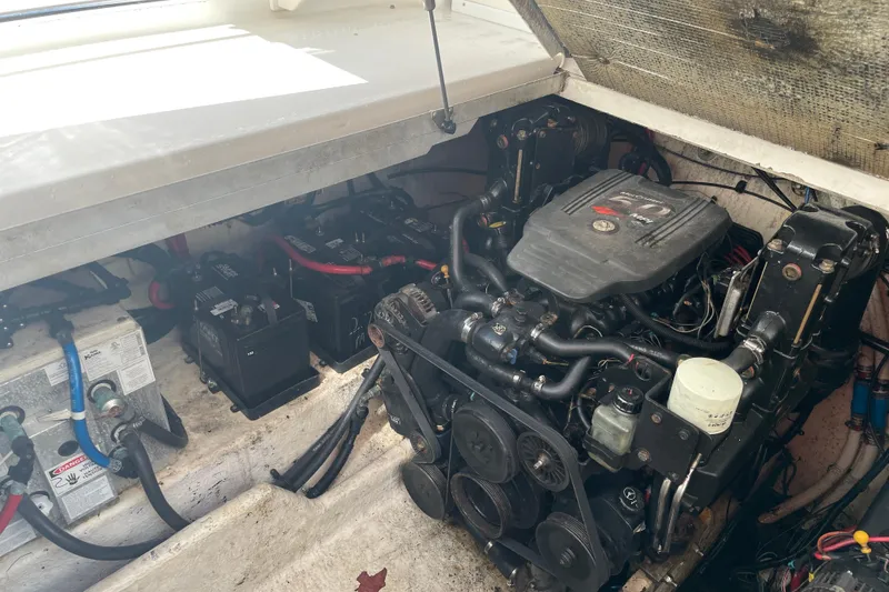 Slide: The Image of Engine compartment of 2006 Sea Ray 290 Amberjack with visible batteries and wiring. - 53