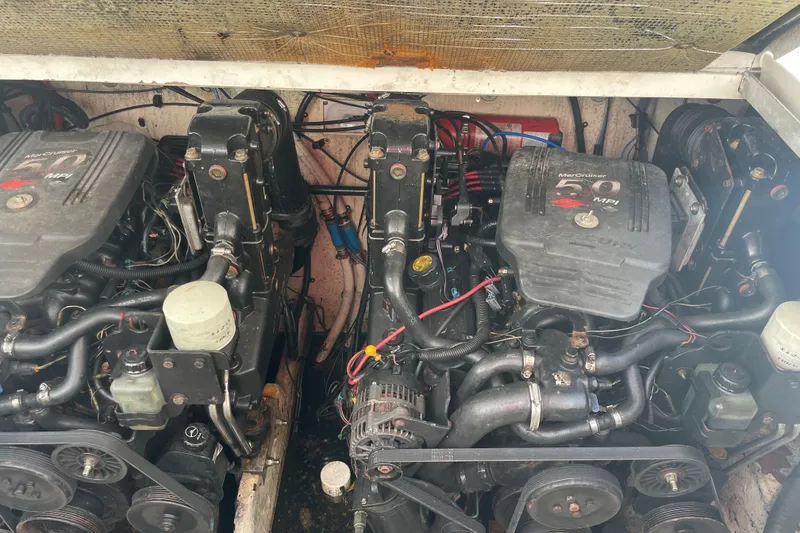 Slide: The Image of Engine compartment of a 2006 Sea Ray 290 Amberjack with twin MerCruiser engines. - 54