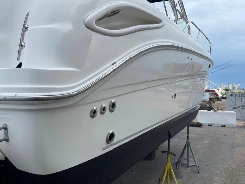 Slide: The Image of 2006 Sea Ray 290 Amberjack boat on stands, side view. - 6