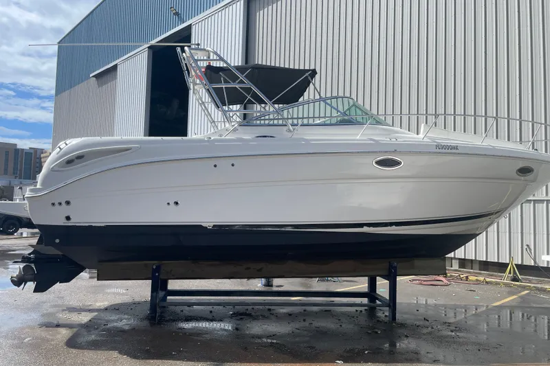 Slide: The Image of 2006 Sea Ray 290 Amberjack boat on display outside a warehouse. - 62