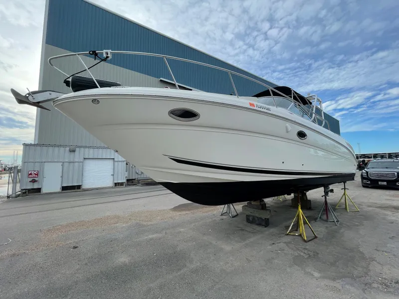 Slide: The Image of 2006 Sea Ray 290 Amberjack boat on dry dock for maintenance. - 8