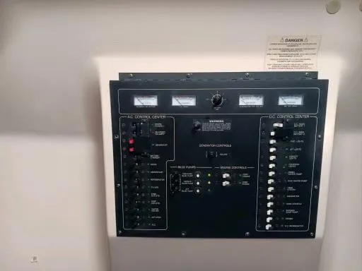 Slide: The Image of Electrical control panel of a 1995 Luhrs 32 Tournament Open boat. - 12