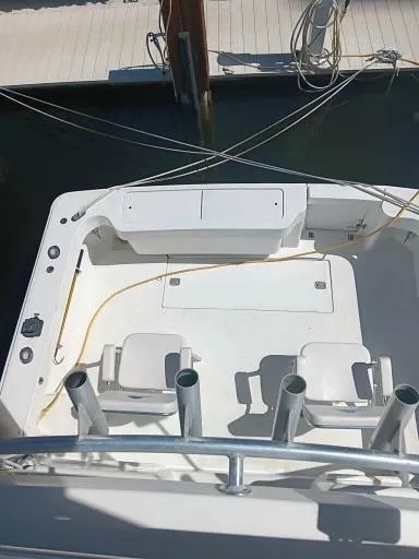 Slide: The Image of 1995 Luhrs 32 Tournament Open boat deck with seating and rod holders. - 4