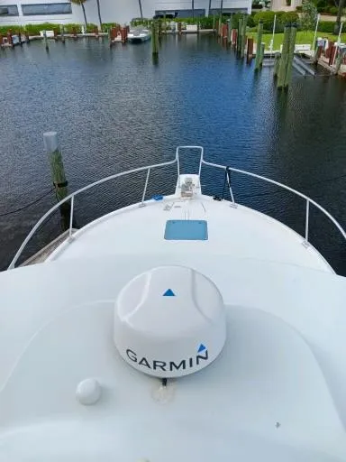 Slide: The Image of 1995 Luhrs 32 Tournament Open boat with Garmin navigation system docked in marina. - 5