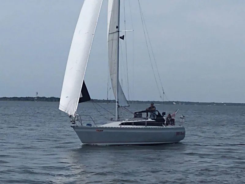 Slide: The Image of 1987 O'Day 322 sailboat cruising on calm waters. - 11