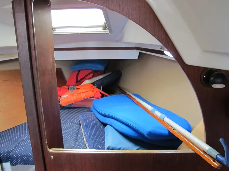 Slide: The Image of Interior cabin of a 1987 O'Day 322 sailboat with cushions and life jackets. - 28