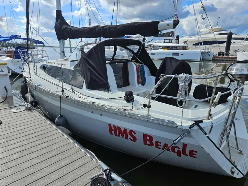 Slide: The Image of 1987 O'Day 322 sailboat HMS Beagle docked at marina. - 3