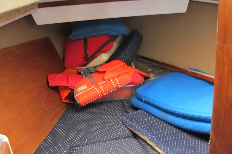 Slide: The Image of Interior cabin of 1987 O'Day 322 sailboat with life jackets and cushions. - 37