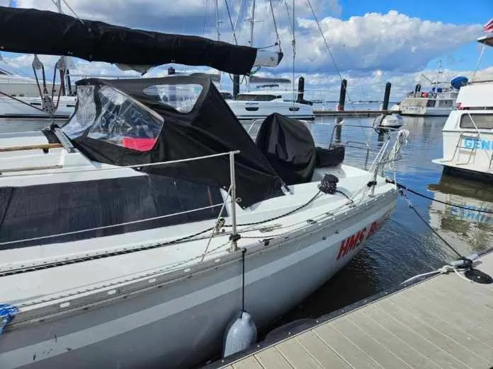 Slide: The Image of 1987 O'Day 322 sailboat docked at marina on a sunny day. - 4