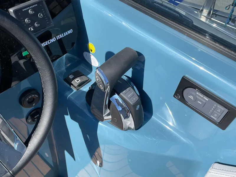 Slide: The Image of Control panel of 2022 Cranchi 26 Rider boat with throttle and steering wheel. - 15