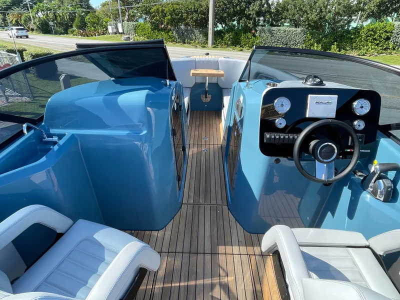 Slide: The Image of 2022 Cranchi 26 Rider boat interior with modern dashboard and seating. - 16