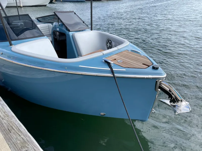 Slide: The Image of 2022 Cranchi 26 Rider boat docked on calm water. - 3