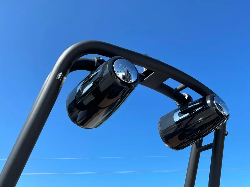 Slide: The Image of Black speakers on Cranchi 26 Rider boat against clear blue sky, 2022 model. - 31