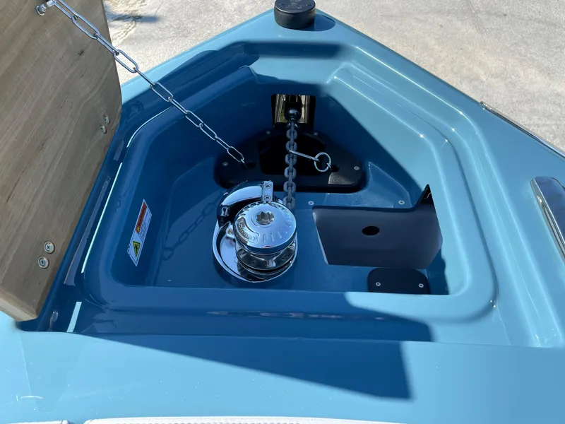 Slide: The Image of Anchor compartment of 2022 Cranchi 26 Rider boat with chain and winch. - 8