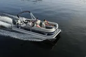 The Image of 2024 SunChaser Vista 22 LR pontoon boat cruising on a lake. - 1