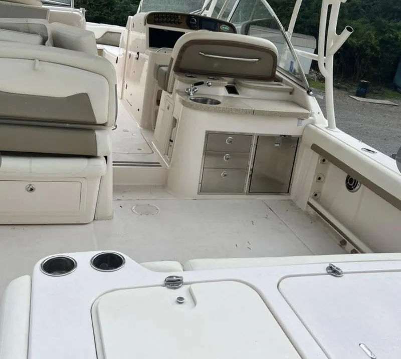 Slide: The Image of 2014 Grady-White Freedom 335 boat interior with seating and helm station. - 4