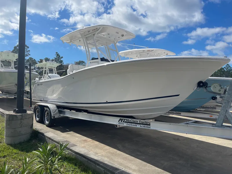 Slide: The Image of 2024 Sea Fox 248 Commander boat on trailer under blue sky. - 1