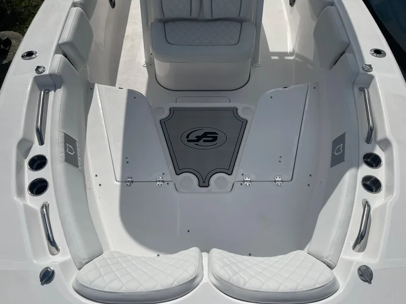 Slide: The Image of 2024 Sea Fox 248 Commander boat interior with cushioned seating and storage compartments. - 10