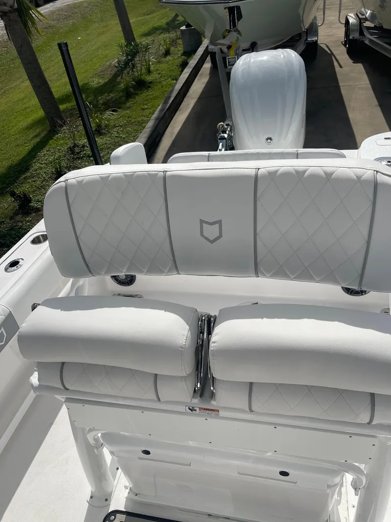 Slide: The Image of 2024 Sea Fox 248 Commander boat with white cushioned seating. - 19