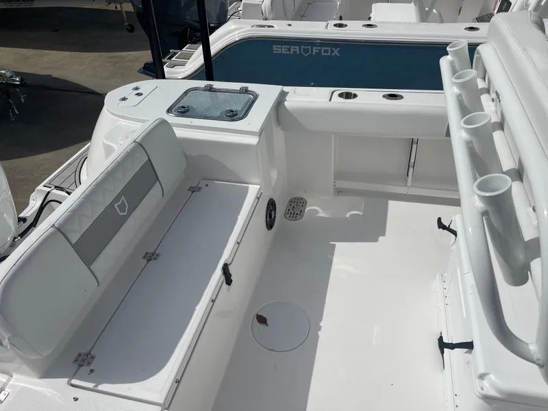 Slide: The Image of 2024 Sea Fox 248 Commander boat interior with seating and storage compartments. - 20