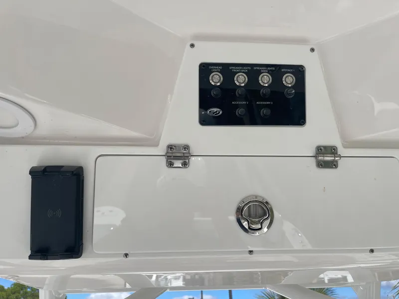 Slide: The Image of Control panel and storage compartment on a 2024 Sea Fox 248 Commander boat. - 5