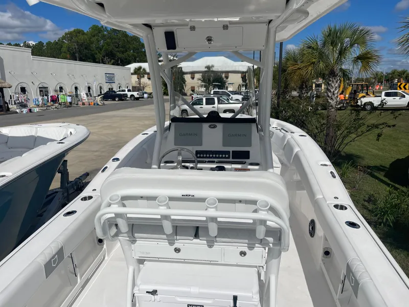 Slide: The Image of 2024 Sea Fox 248 Commander boat with dual Garmin displays and white interior. - 8