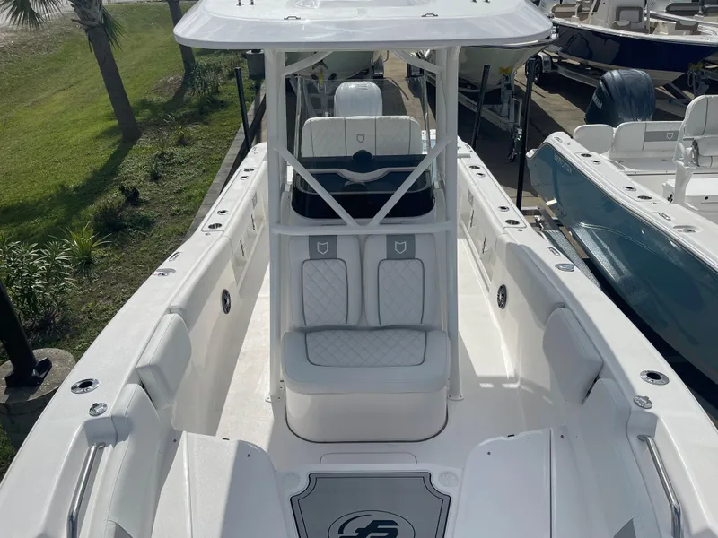 Slide: The Image of 2024 Sea Fox 248 Commander boat interior with white seating and console. - 9