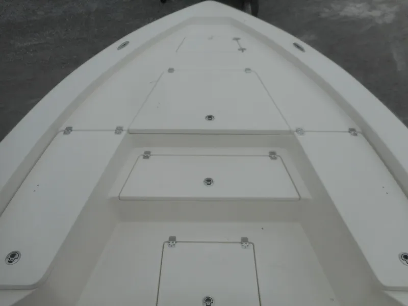 Slide: The Image of 2024 Avenger 24 Avenger boat deck with storage compartments. - 11
