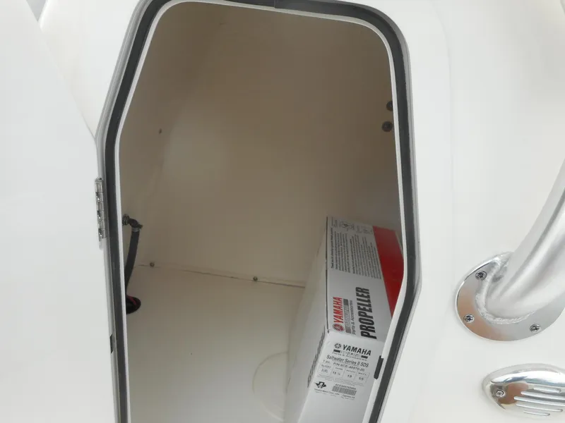 Slide: The Image of Storage compartment of 2024 Avenger 24 Avenger boat with Yamaha propeller box. - 13