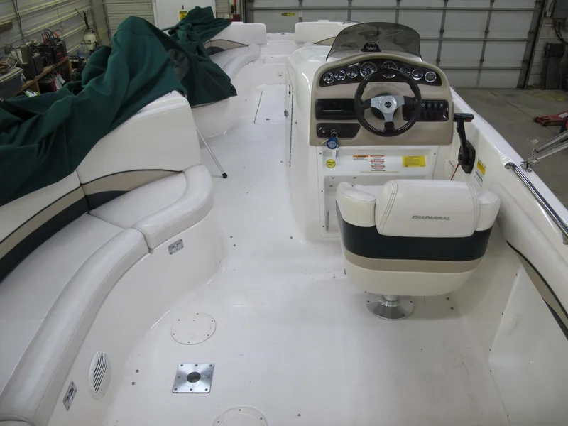 Slide: The Image of 1998 Chaparral 252 Sunesta boat interior with helm and seating. - 4