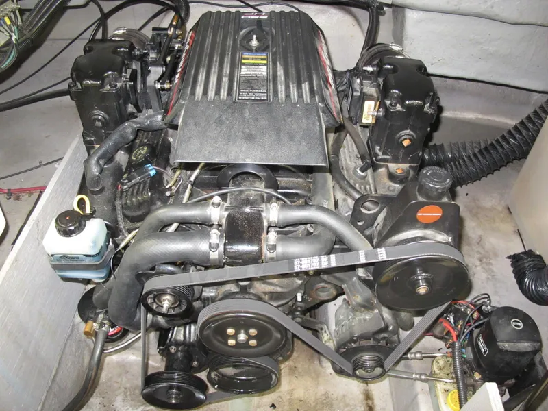 Slide: The Image of 1998 Chaparral 252 Sunesta boat engine compartment with visible components. - 9