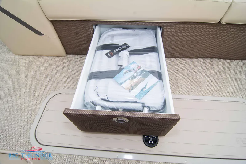 Slide: The Image of Storage compartment in 2023 Crest Classic Platinum 240 SLC boat. - 11