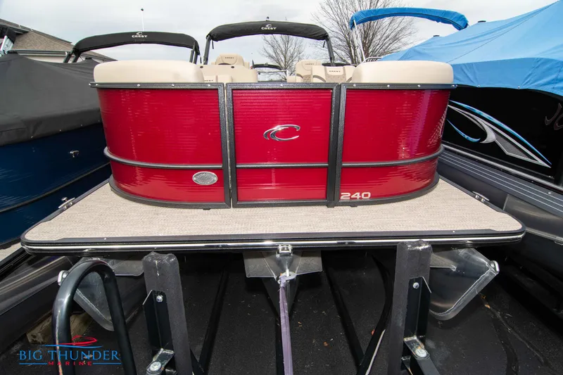 Slide: The Image of 2023 Crest Classic Platinum 240 SLC pontoon boat in red, displayed at Big Thunder Marine. - 2