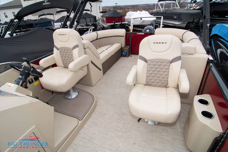 Slide: The Image of 2023 Crest Classic Platinum 240 SLC pontoon boat interior with beige seating. - 25