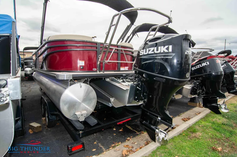 Slide: The Image of 2023 Crest Classic Platinum 240 SLC pontoon boat with Suzuki outboard motor. - 3