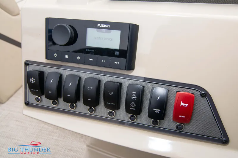 Slide: The Image of Control panel of 2023 Crest Classic Platinum 240 SLC boat with Fusion audio system. - 32