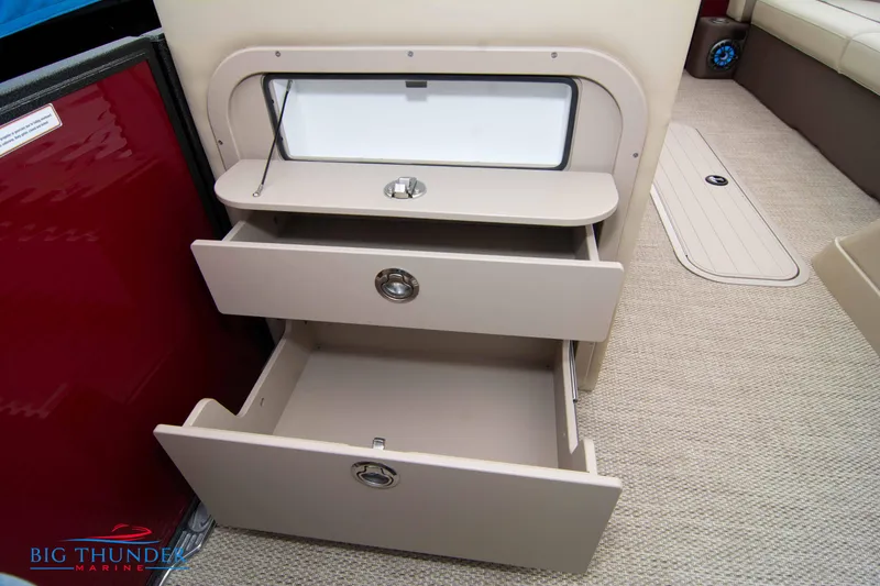Slide: The Image of 2023 Crest Classic Platinum 240 SLC storage drawers and compartment on beige carpet. - 37