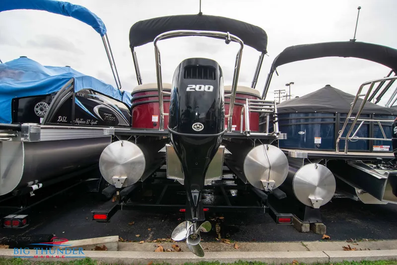 Slide: The Image of 2023 Crest Classic Platinum 240 SLC pontoon boat with 200 HP engine, rear view. - 4