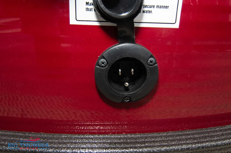 Slide: The Image of Close-up of a 2023 Crest Classic Platinum 240 SLC boat's electrical outlet. - 43