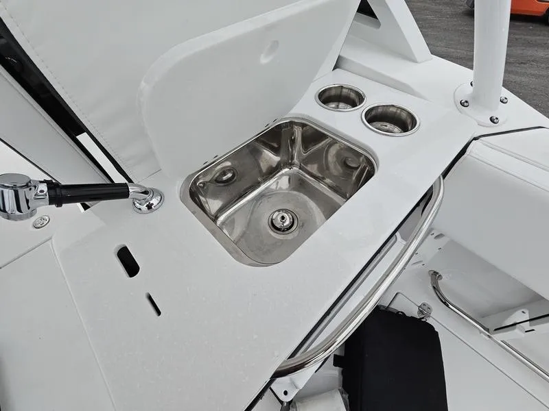 Slide: The Image of 2024 Blackfin 252 DC boat sink and cup holders. - 14
