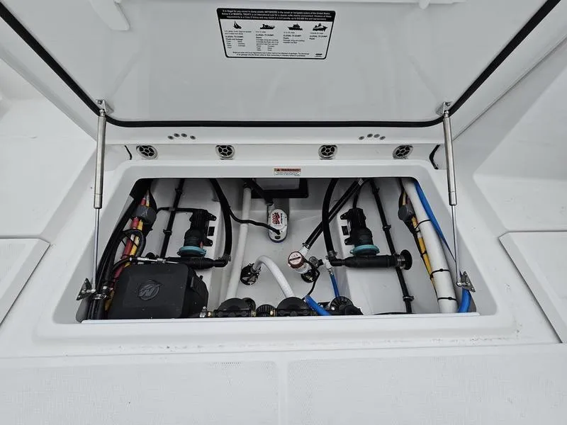 Slide: The Image of 2024 Blackfin 252 DC boat engine compartment with wiring and components. - 15