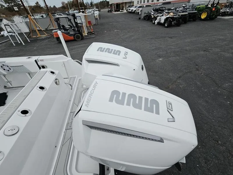 Slide: The Image of 2024 Blackfin 252 DC boat with twin Mercury V6 outboard engines. - 4