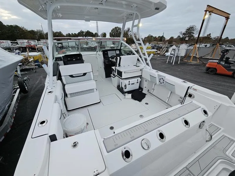 Slide: The Image of 2024 Blackfin 252 DC boat interior with seating and fishing equipment. - 5