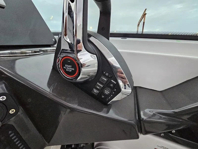 Slide: The Image of 2024 Blackfin 252 DC boat throttle control with start/stop button. - 8